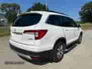 2022 Honda Pilot EX-L with VIN 5FNYF6H50NB018186, listed as a Copart auction lot 80308255 with 147,297 mi miles and Clean title. Bid and sale history available at DreamBid. Image 4.