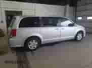 2012 Dodge Grand Caravan American Value z VIN 2C4RDGBGXCR105234, wystawiony jako Copart lot #69327725 z przebiegiem 141 911 mil mil oraz Szkoda całkowita • Salvage title. Historia ofert i sprzedaży dostępna na DreamBid. Obrazek 3.