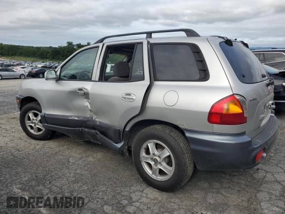 2003 Hyundai Santa Fe LX с VIN KM8SC73E23U528101, выставлен на аукционе Copart как лот 69006105 с пробегом 152 810 миль миль и Списание • Salvage title. История ставок и продаж доступна на DreamBid. Изображение 2.