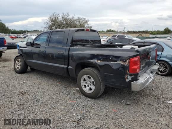 2005 Dodge Dakota SLT with VIN 1D7HE48K05S247795, listed as a Copart auction lot 65764825 with 157,292 mi miles and Salvage title. Bid and sale history available at DreamBid. Image 2.