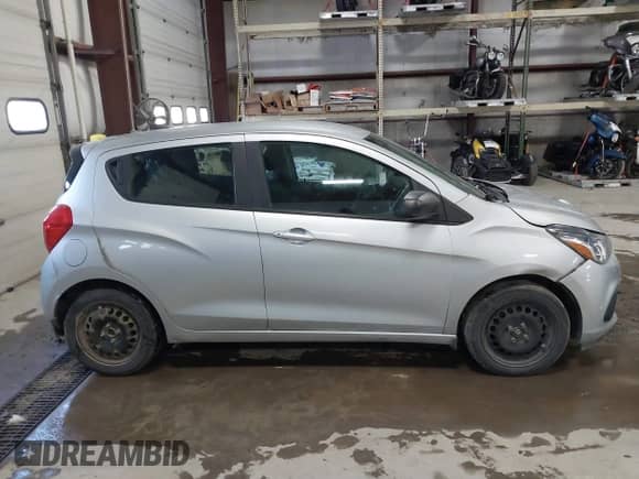 2018 Chevrolet Spark LS z VIN KL8CB6SA4JC458942, wystawiony jako IAAI lot #41238821 z przebiegiem 122 515 mil mil oraz . Historia ofert i sprzedaży dostępna na DreamBid. Obrazek 13.