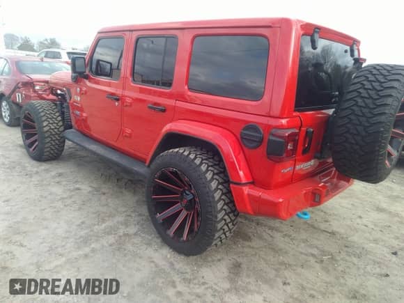 2022 Jeep Wrangler Unlimited Sahara with VIN 1C4JJXP62NW136932, listed as a IAAI auction lot 41486025 with 36,986 mi miles and . Bid and sale history available at DreamBid. Image 3.