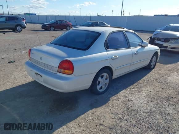 2001 Hyundai Sonata with VIN KMHWF25S41A403128, listed as a IAAI auction lot 43554850 with 212,602 mi miles and . Bid and sale history available at DreamBid. Image 4.