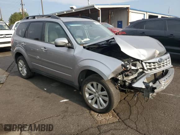 2011 Subaru Forester X Premium with VIN JF2SHADC1BH712339, listed as a Copart auction lot 66895135 with 183,845 mi miles and Salvage title. Bid and sale history available at DreamBid. Image 4.