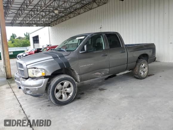 2005 Dodge 1500 SLT with VIN 1D7HU18D05S162958, listed as a Copart auction lot 69061115 with 174,808 mi miles and Salvage title. Bid and sale history available at DreamBid. Image 1.
