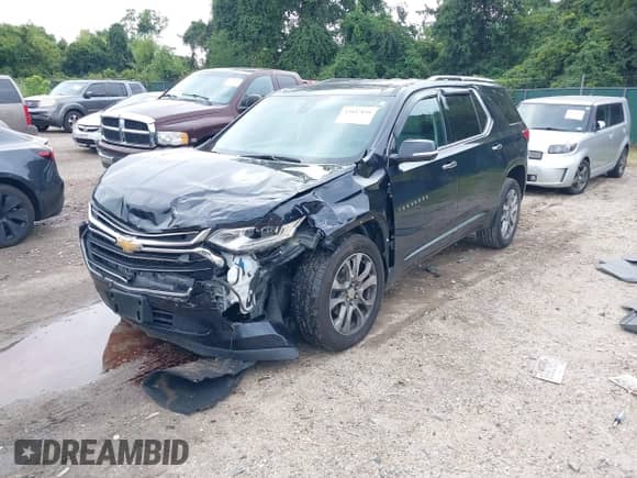 2020 Chevrolet Traverse Premier with VIN 1GNEVKKWXLJ100651, listed as a IAAI auction lot 43047891 with 82,498 mi miles and . Bid and sale history available at DreamBid. Image 2.