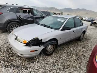 2000 Saturn SL with VIN 1G8ZH5284YZ240606, listed as a Copart auction lot 80808315 with 206,722 mi miles and Salvage title. Bid and sale history available at DreamBid. Image 1.