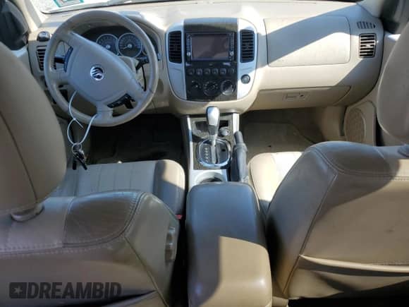 2007 Mercury Mariner Premier with VIN 4M2CU97107KJ12925, listed as a Copart auction lot 62371895 with 141,576 mi miles and Salvage title. Bid and sale history available at DreamBid. Image 8.