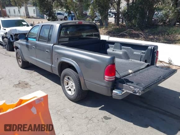 2002 Dodge Dakota SLT with VIN 1B7HL48N32S587531, listed as a IAAI auction lot 42266638 with 151,397 mi miles and . Bid and sale history available at DreamBid. Image 3.