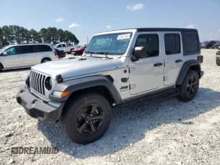 2023 Jeep Wrangler Willys with VIN 1C4HJXDG5PW653950, listed as a Copart auction lot 61857165 with 19,633 mi miles and Salvage title. Bid and sale history available at DreamBid. Image 1.