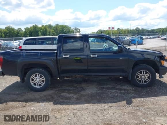 2011 Chevrolet Colorado 1LT z VIN 1GCHTCFE7B8136127, wystawiony jako IAAI lot #43083805 z przebiegiem 130 785 mil mil oraz . Historia ofert i sprzedaży dostępna na DreamBid. Obrazek 13.