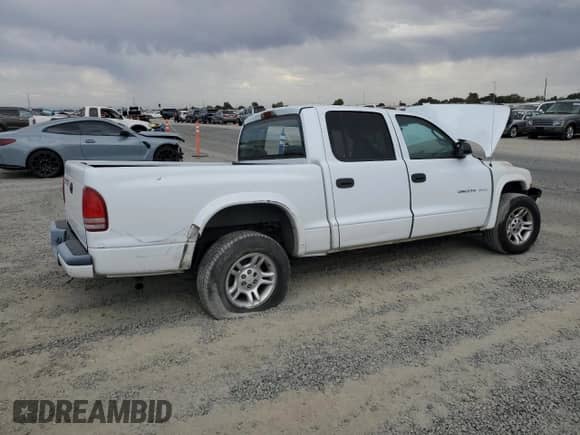 2002 Dodge Dakota Sport z VIN 1B7HL38X92S587514, wystawiony jako Copart lot #81796315 z przebiegiem Nie podano mil oraz Szkoda całkowita • Salvage title. Historia ofert i sprzedaży dostępna na DreamBid. Obrazek 3.