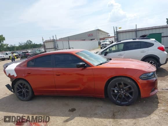 2021 Dodge Charger SXT with VIN 2C3CDXBG7MH612920, listed as a IAAI auction lot 43197794 with 77,359 mi miles and . Bid and sale history available at DreamBid. Image 14.