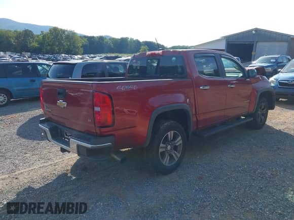 2015 Chevrolet Colorado 4WD LT z VIN 1GCGTBE31F1184744, wystawiony jako IAAI lot #42988122 z przebiegiem 122 987 mil mil oraz . Historia ofert i sprzedaży dostępna na DreamBid. Obrazek 4.