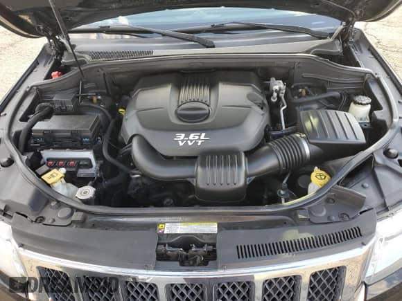 2012 Jeep Grand Cherokee Overland z VIN 1C4RJFCG2CC252898, wystawiony jako Copart lot #80726185 z przebiegiem 91 276 mil mil oraz Szkoda całkowita • Salvage title. Historia ofert i sprzedaży dostępna na DreamBid. Obrazek 12.