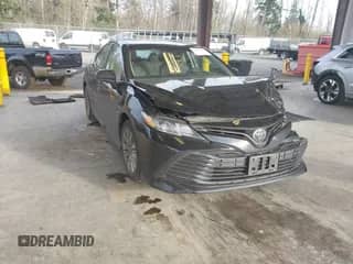 2020 Toyota Camry LE with VIN 4T1C11AKXLU363530, listed as a IAAI auction lot 41670307 with 86,459 mi miles and . Bid and sale history available at DreamBid. Image 1.