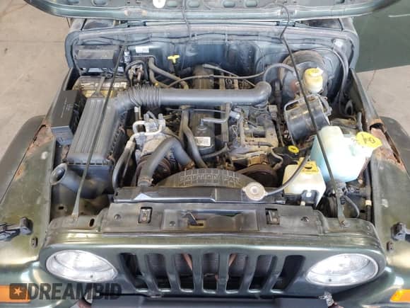 1997 Jeep Wrangler Sahara z VIN 1J4FY49S0VP476305, wystawiony jako Copart lot #68818145 z przebiegiem 180 174 mil mil oraz Czysty tytuł • Clean title. Historia ofert i sprzedaży dostępna na DreamBid. Obrazek 12.