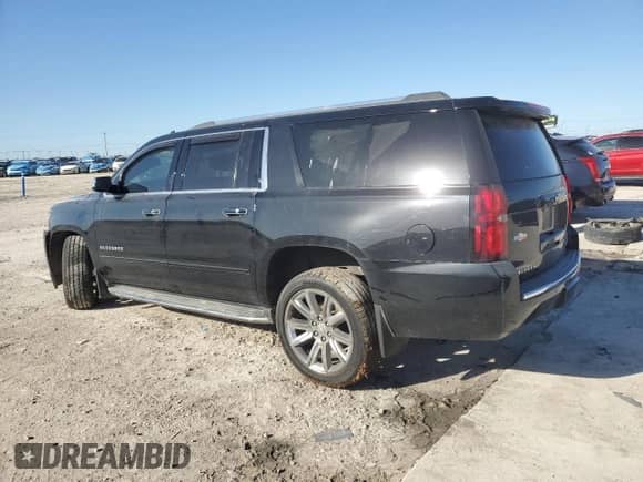 2019 Chevrolet Suburban Premier with VIN 1GNSCJKCXKR408508, listed as a Copart auction lot 50618465 with 79,258 mi miles and Salvage title. Bid and sale history available at DreamBid. Image 2.