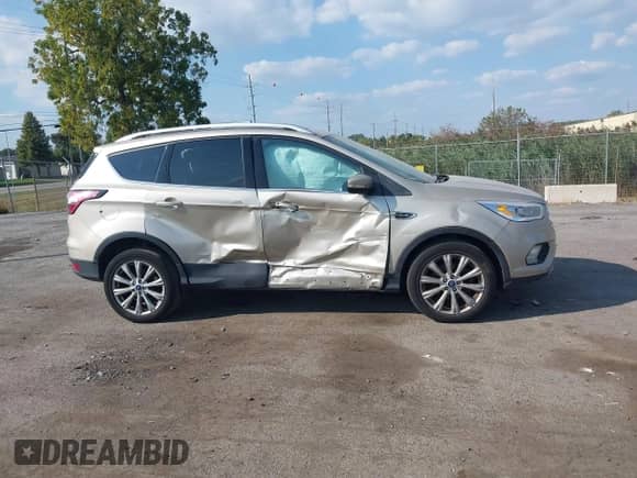 2017 Ford Escape Titanium with VIN 1FMCU0JD7HUE92688, listed as a IAAI auction lot 43171142 with 156,576 mi miles and . Bid and sale history available at DreamBid. Image 13.