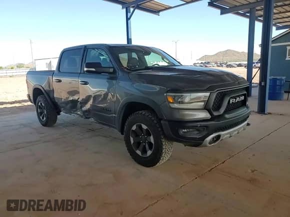 2020 Ram 1500 Rebel z VIN 1C6SRFLT4LN385004, wystawiony jako Copart lot #81076245 z przebiegiem 74 355 mil mil oraz Szkoda całkowita • Salvage title. Historia ofert i sprzedaży dostępna na DreamBid. Obrazek 13.