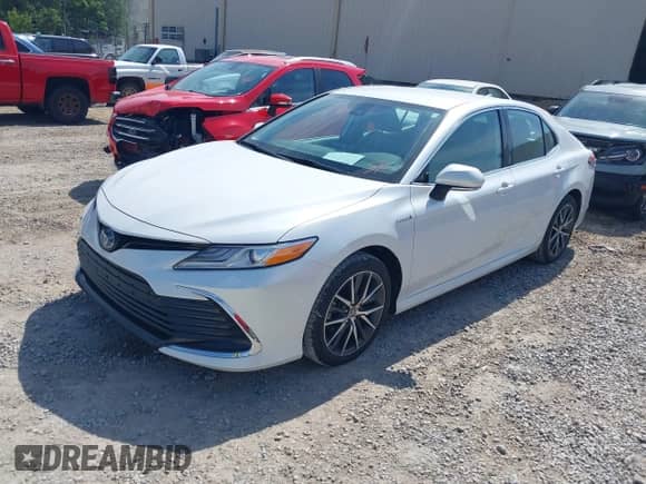 2021 Toyota Camry Hybrid XLE with VIN 4T1F31AKXMU556673, listed as a IAAI auction lot 42018439 with 56,429 mi miles and . Bid and sale history available at DreamBid. Image 2.