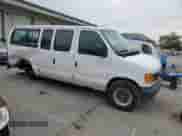 2003 Ford Econoline Cargo with VIN 1FTNE24W43HB61331, listed as a Copart auction lot 60618495 with 142,451 mi miles and Salvage title. Bid and sale history available at DreamBid. Image 4.