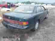 1993 Toyota Camry LE z VIN 4T1SK12E8PU307495, wystawiony jako IAAI lot #42265324 z przebiegiem 296 381 mil mil oraz . Historia ofert i sprzedaży dostępna na DreamBid. Obrazek 4.