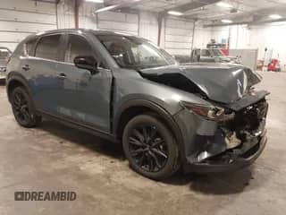 2023 Mazda CX-5 S Carbon Edition z VIN JM3KFBCM1P0238345, wystawiony jako IAAI lot #42799769 z przebiegiem 53 614 mil mil oraz . Historia ofert i sprzedaży dostępna na DreamBid. Obrazek 1.