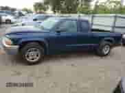 2004 Dodge Dakota SLT z VIN 1D7GL42N54S721808, wystawiony jako Copart lot #73992034 z przebiegiem Nie podano mil oraz Szkoda całkowita • Salvage title. Historia ofert i sprzedaży dostępna na DreamBid. Obrazek 1.