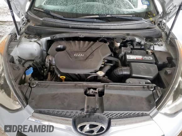 2014 Hyundai Veloster z VIN KMHTC6AD3EU214209, wystawiony jako Copart lot #69948355 z przebiegiem 144 925 mil mil oraz Szkoda całkowita • Salvage title. Historia ofert i sprzedaży dostępna na DreamBid. Obrazek 11.