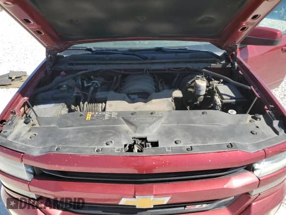 2018 Chevrolet Silverado 1500 LT z VIN 3GCUKREC9JG599450, wystawiony jako Copart lot #82511955 z przebiegiem 139 641 mil mil oraz Szkoda całkowita • Salvage title. Historia ofert i sprzedaży dostępna na DreamBid. Obrazek 11.