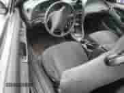 2004 Ford Mustang Standard z VIN 1FAFP404X4F102320, wystawiony jako Copart lot #69844875 z przebiegiem 215 254 mil mil oraz Szkoda całkowita • Salvage title. Historia ofert i sprzedaży dostępna na DreamBid. Obrazek 8.