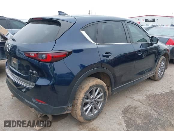 2022 Mazda CX-5 S Select z VIN JM3KFBBM2N0534666, wystawiony jako IAAI lot #43139413 z przebiegiem 102 819 mil mil oraz . Historia ofert i sprzedaży dostępna na DreamBid. Obrazek 4.