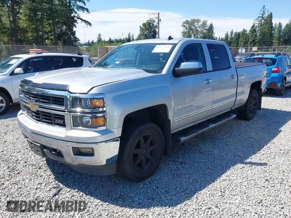 2014 Chevrolet Silverado 1500 LTZ with VIN 1GCUKSEC4EF197043, listed as a IAAI auction lot 42673341 with 131,445 mi miles and . Bid and sale history available at DreamBid. Image 2.