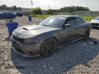 2020 Dodge Charger R/T with VIN 2C3CDXCTXLH126757, listed as a Copart auction lot 70051085 with 124,478 mi miles and Salvage title. Bid and sale history available at DreamBid. Image 1.