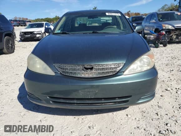 2004 Toyota Camry LE z VIN 4T1BF32K54U064570, wystawiony jako Copart lot #84811775 z przebiegiem 247 059 mil mil oraz Czysty tytuł • Clean title. Historia ofert i sprzedaży dostępna na DreamBid. Obrazek 5.