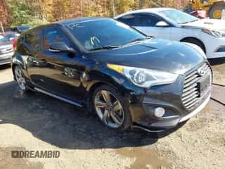 2013 Hyundai Veloster Turbo z VIN KMHTC6AE8DU156928, wystawiony jako IAAI lot #43471857 z przebiegiem 103 265 mil mil oraz . Historia ofert i sprzedaży dostępna na DreamBid. Obrazek 1.