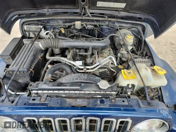 2003 Jeep Wrangler X z VIN 1J4FA39S33P356428, wystawiony jako Copart lot #70285135 z przebiegiem 147 788 mil mil oraz Szkoda całkowita • Salvage title. Historia ofert i sprzedaży dostępna na DreamBid. Obrazek 11.