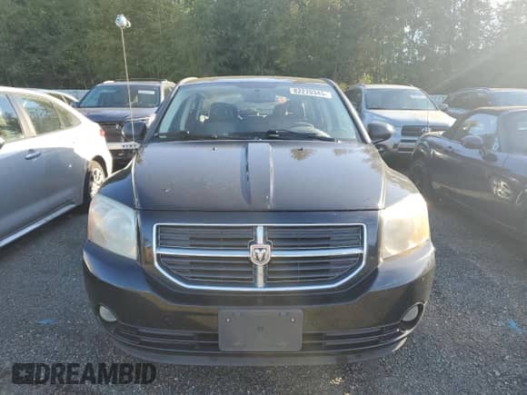 2009 Dodge Caliber SXT with VIN 1B3HB48A39D130816, listed as a Copart auction lot 82270345 with 106,380 mi miles and Salvage title. Bid and sale history available at DreamBid. Image 5.