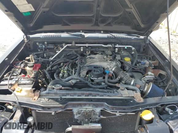 2003 Nissan Frontier XE with VIN 1N6ED29Y03C423496, listed as a Copart auction lot 60175985 with 163,042 mi miles and Salvage title. Bid and sale history available at DreamBid. Image 11.