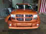 2011 Dodge Nitro Shock z VIN 1D4PU7GX8BW590952, wystawiony jako Copart lot #64893755 z przebiegiem 135 449 mil mil oraz Szkoda całkowita • Salvage title. Historia ofert i sprzedaży dostępna na DreamBid. Obrazek 5.