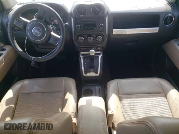 2014 Jeep Compass Latitude with VIN 1C4NJCEA4ED643134, listed as a Copart auction lot 71044335 with 103,025 mi miles and Salvage title. Bid and sale history available at DreamBid. Image 8.