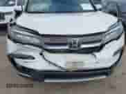 2021 Honda Pilot Elite with VIN 5FNYF6H04MB079091, listed as a IAAI auction lot 42739979 with 62,723 mi miles and . Bid and sale history available at DreamBid. Image 6.