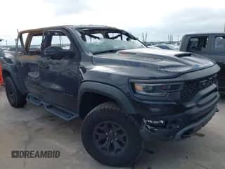 2023 Ram 1500 TRX z VIN 1C6SRFU94PN509443, wystawiony jako IAAI lot #42211547 z przebiegiem 32 378 mil mil oraz . Historia ofert i sprzedaży dostępna na DreamBid. Obrazek 1.