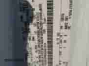 2013 Ford Econoline Cargo Commercial z VIN 1FTNS2EW5DDA61514, wystawiony jako Copart lot #85203014 z przebiegiem 158 672 mil mil oraz Szkoda całkowita • Salvage title. Historia ofert i sprzedaży dostępna na DreamBid. Obrazek 13.