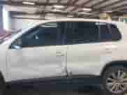 2013 Volkswagen Tiguan with VIN WVGCV3AX7DW605594, listed as a IAAI auction lot 42057457 with 131,629 mi miles and . Bid and sale history available at DreamBid. Image 14.