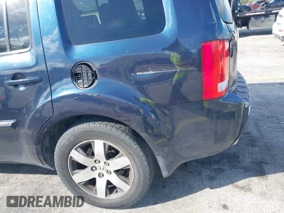 2012 Honda Pilot Touring with VIN 5FNYF3H95CB039789, listed as a IAAI auction lot 43555620 with 261,011 mi miles and . Bid and sale history available at DreamBid. Image 19.