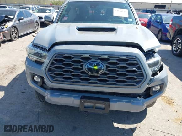 2021 Toyota Tacoma SR5 z VIN 5TFAZ5CN4MX097831, wystawiony jako IAAI lot #43320227 z przebiegiem 31 588 mil mil oraz . Historia ofert i sprzedaży dostępna na DreamBid. Obrazek 6.