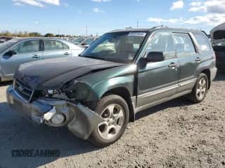 2004 Subaru Forester X with VIN JF1SG65674G701495, listed as a Copart auction lot 75701844 with 210,736 mi miles and Salvage title. Bid and sale history available at DreamBid. Image 1.