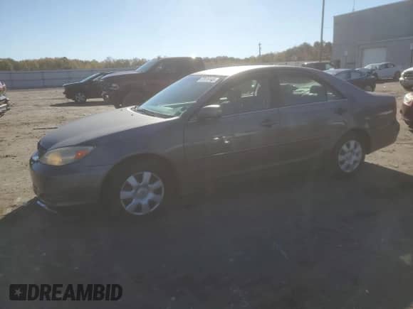 2002 Toyota Camry LE с VIN 4T1BE32K02U573319, выставлен на аукционе Copart как лот 87076145 с пробегом 121 719 миль миль и Списание • Salvage title. История ставок и продаж доступна на DreamBid. Изображение 1.